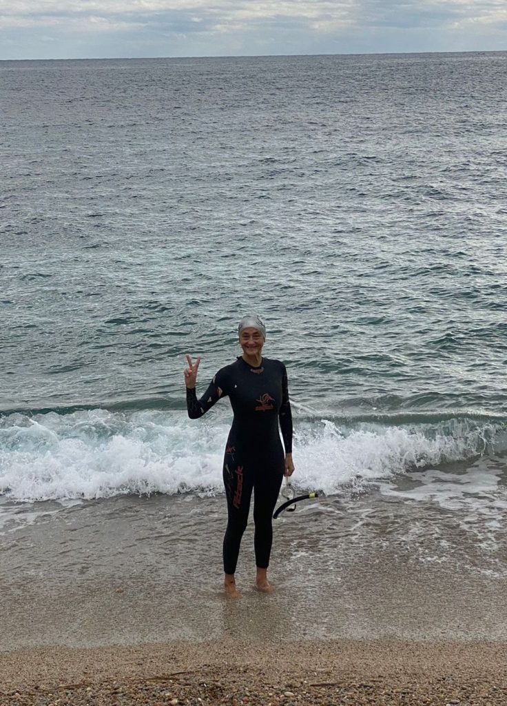 women swimming with a sailfish wetsuit